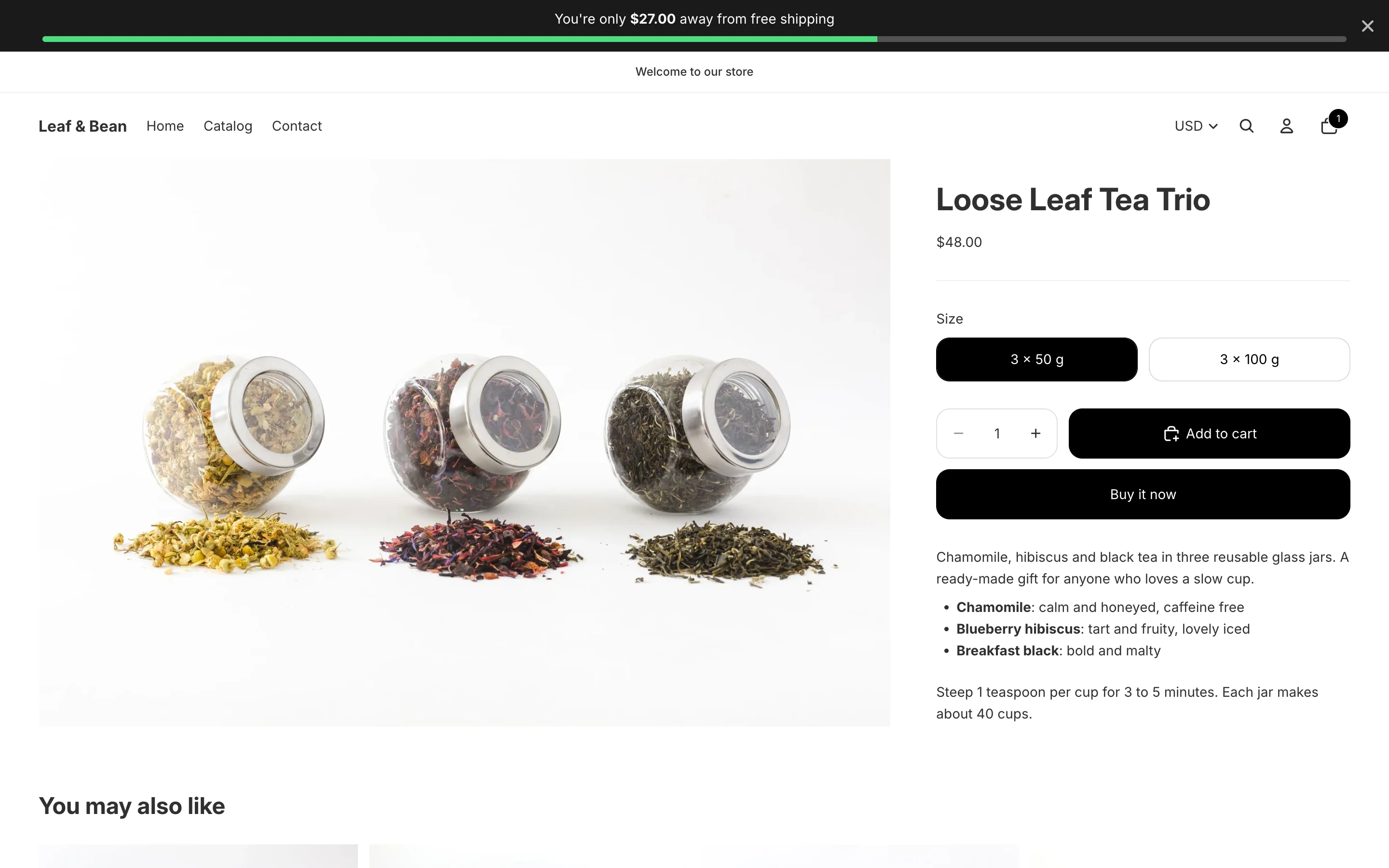 A product page on the storefront with a dark bar at the top reading “You're only $27.00 away from free shipping” and a green progress line.